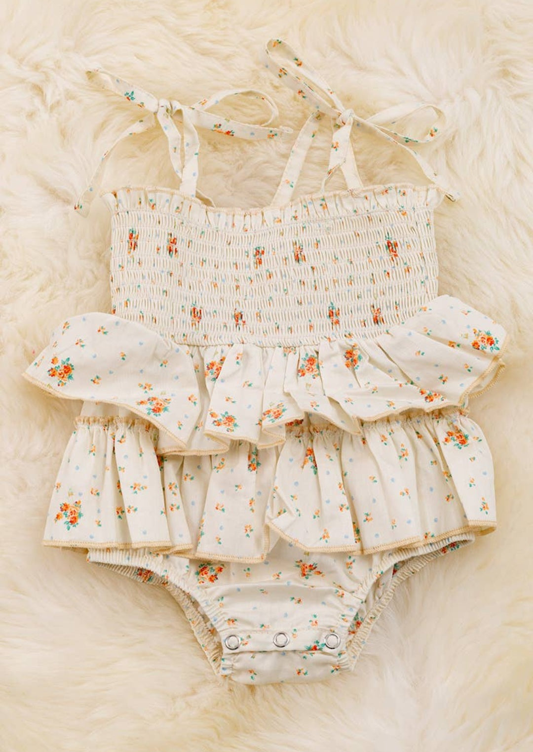 Smocked floral onesie
