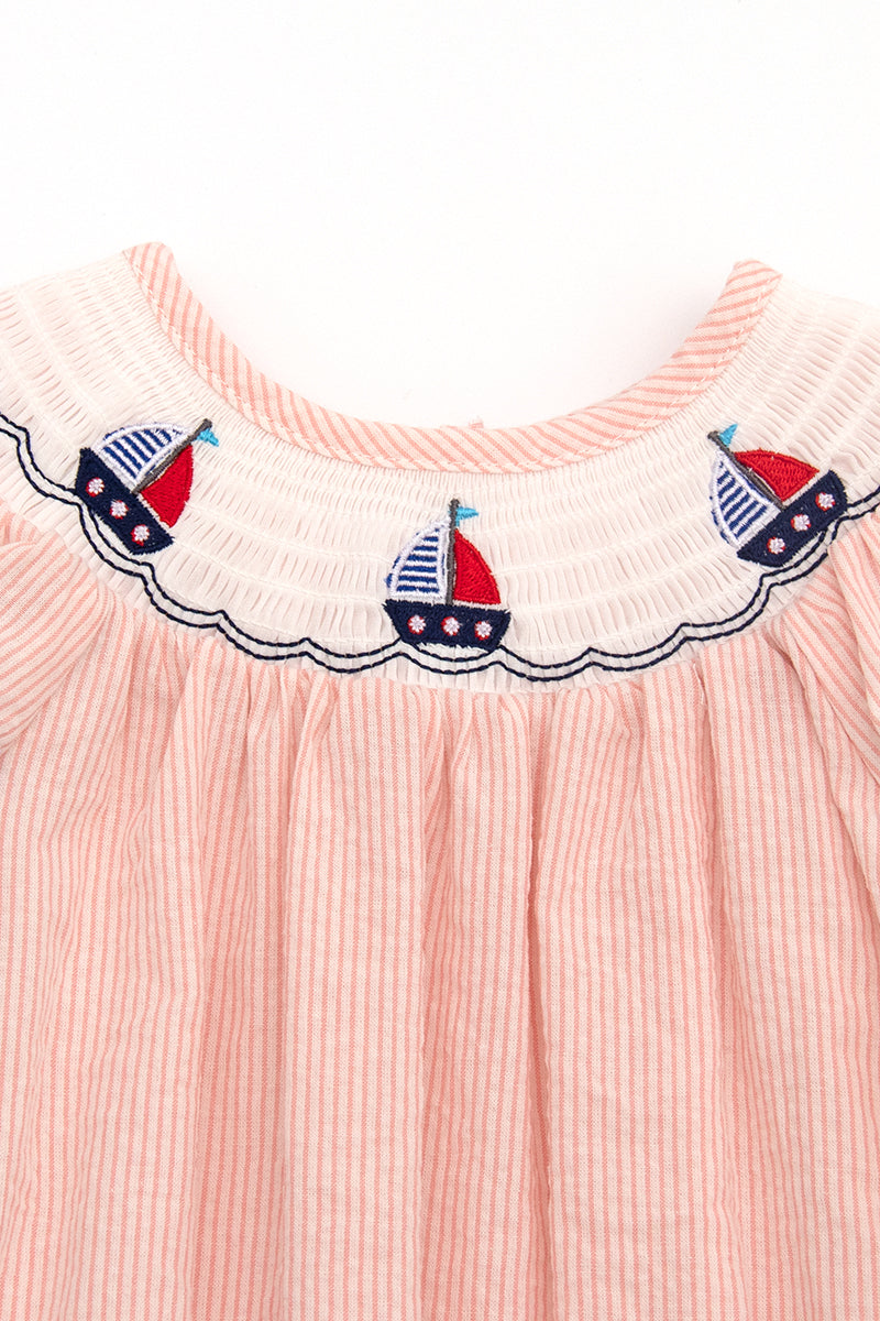 Pink sailboat smocked romper