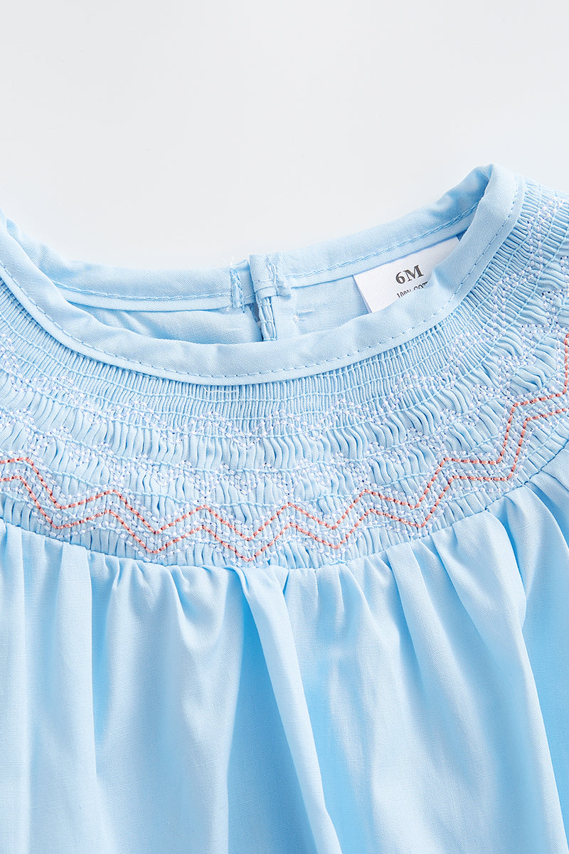 Blue smocked ruffle romper